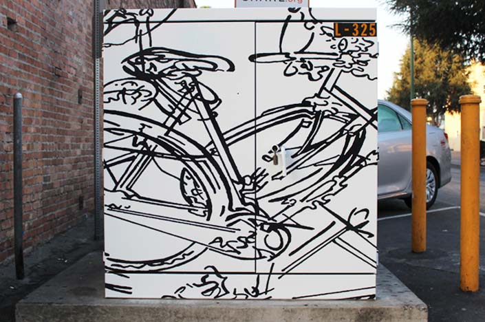 A power box with a bicycle painted on it.
